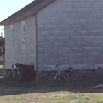 Old bike leaning against shed
